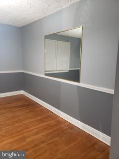 5358 Cuthbert Avenue Baltimore, MD 21215 - Photo 13 of 20 an empty room with wooden floor and closet