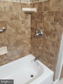 5358 Cuthbert Avenue Baltimore, MD 21215 - Photo 18 of 20 a bathroom with a sink a toilet and a mirror