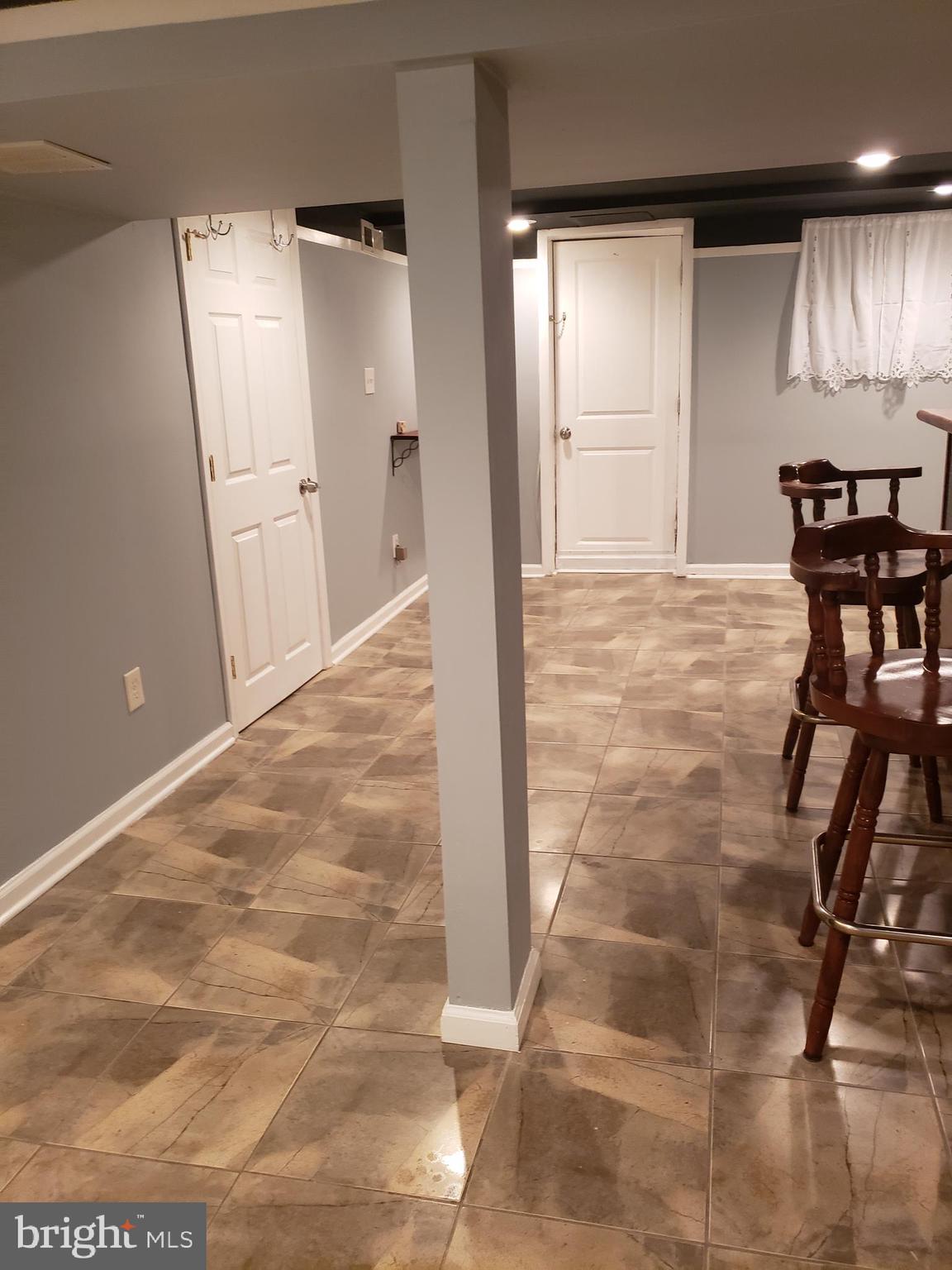 5358 Cuthbert Avenue Baltimore, MD 21215 - Photo 2 of 7 a view of a livingroom with furniture and an empty room