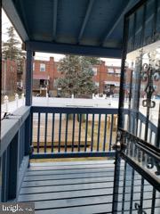 5358 Cuthbert Avenue Baltimore, MD 21215 - Photo 10 of 20 a view of a balcony with wooden floor