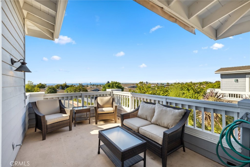 3521 Geranium Avenue, Unit 22 Corona del Mar, CA 92625 - Photo 20 of 37 a view of a roof deck with couches and potted plants