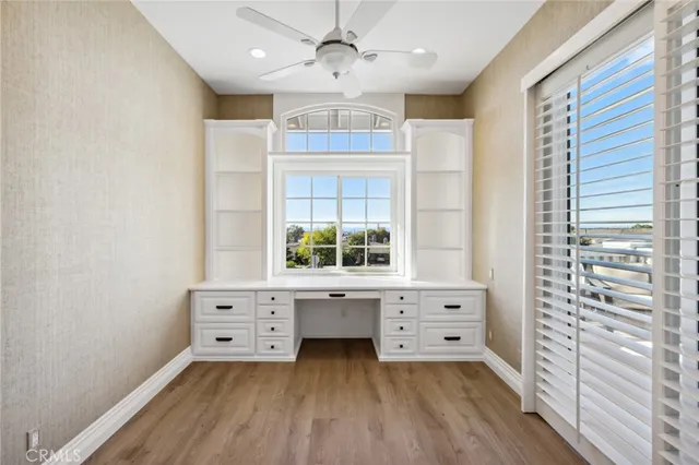 a living room with a bed furniture and a window