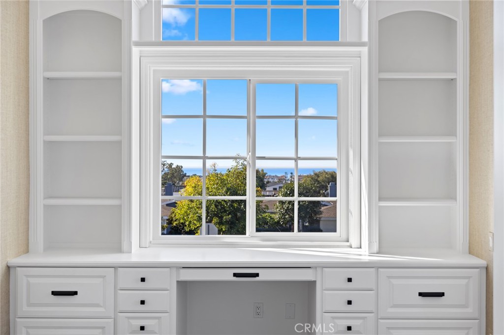 3521 Geranium Avenue, Unit 22 Corona del Mar, CA 92625 - Photo 23 of 37 a view of white cabinets and window with wooden floor