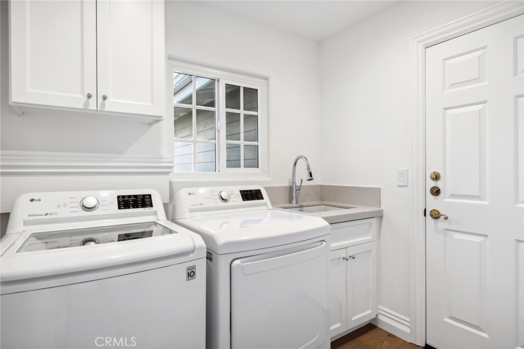 3521 Geranium Avenue, Unit 22 Corona del Mar, CA 92625 - Photo 31 of 37 a view of washer and dryer with bathroom in it