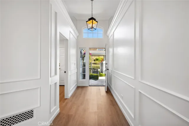 a view of hallway with wooden floor