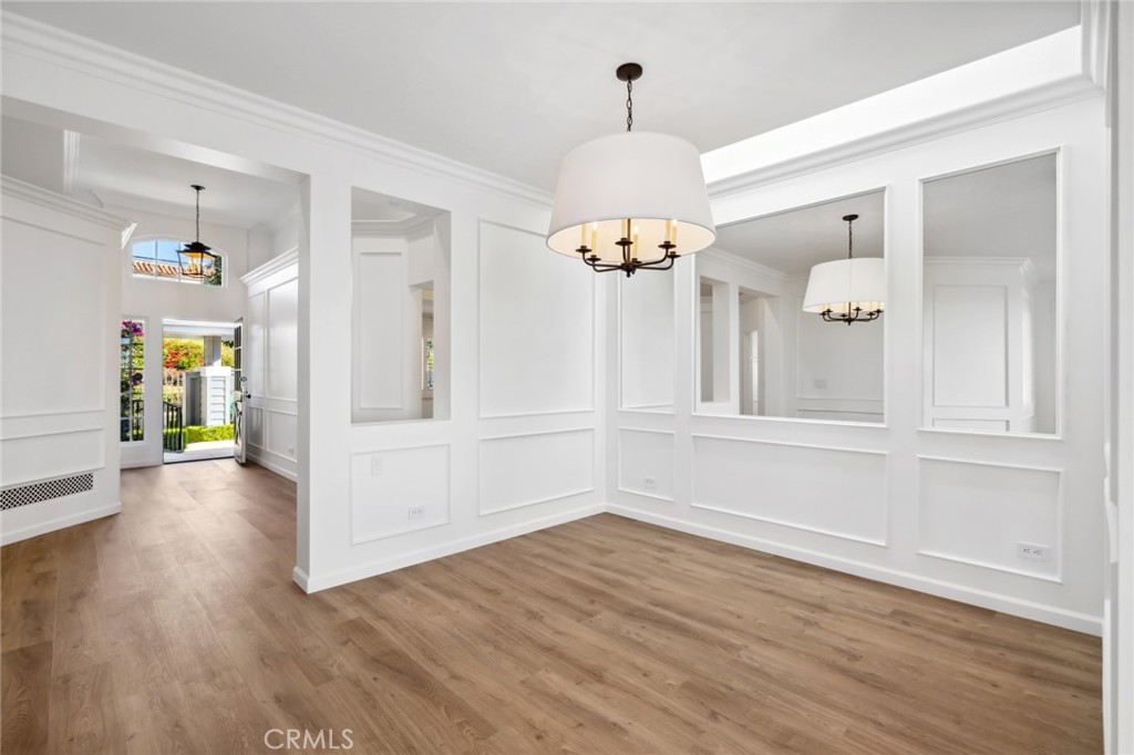 3521 Geranium Avenue, Unit 22 Corona del Mar, CA 92625 - Photo 9 of 37 a view of an entryway with wooden floor