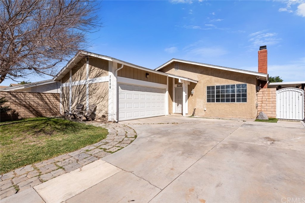7006 Idyllwild Lane Riverside, CA 92503 - Photo 1 of 1 a view of a house with a yard and garage