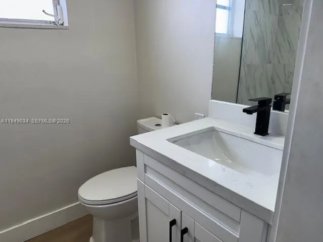 a bathroom with a sink and a toilet