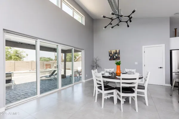 a kitchen with white cabinets stainless steel appliances and sink