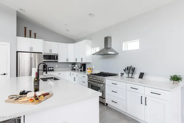 a bedroom with a bed couch and window