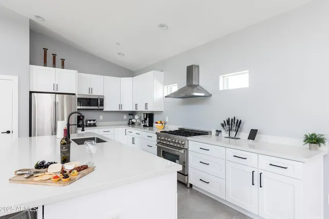 a bedroom with a bed couch and window