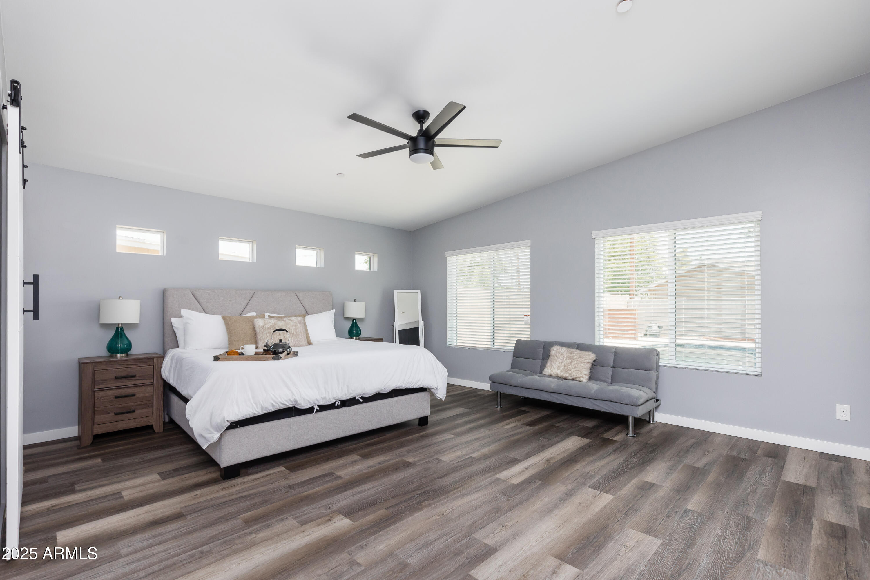3043 North 85th Place Scottsdale, AZ 85251 - Photo 14 of 33 a bedroom with a bed couch and window