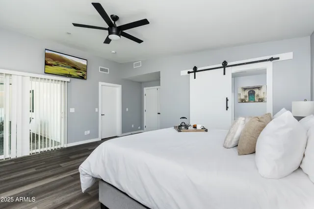 a bathroom with a double vanity sink mirror and bathtub