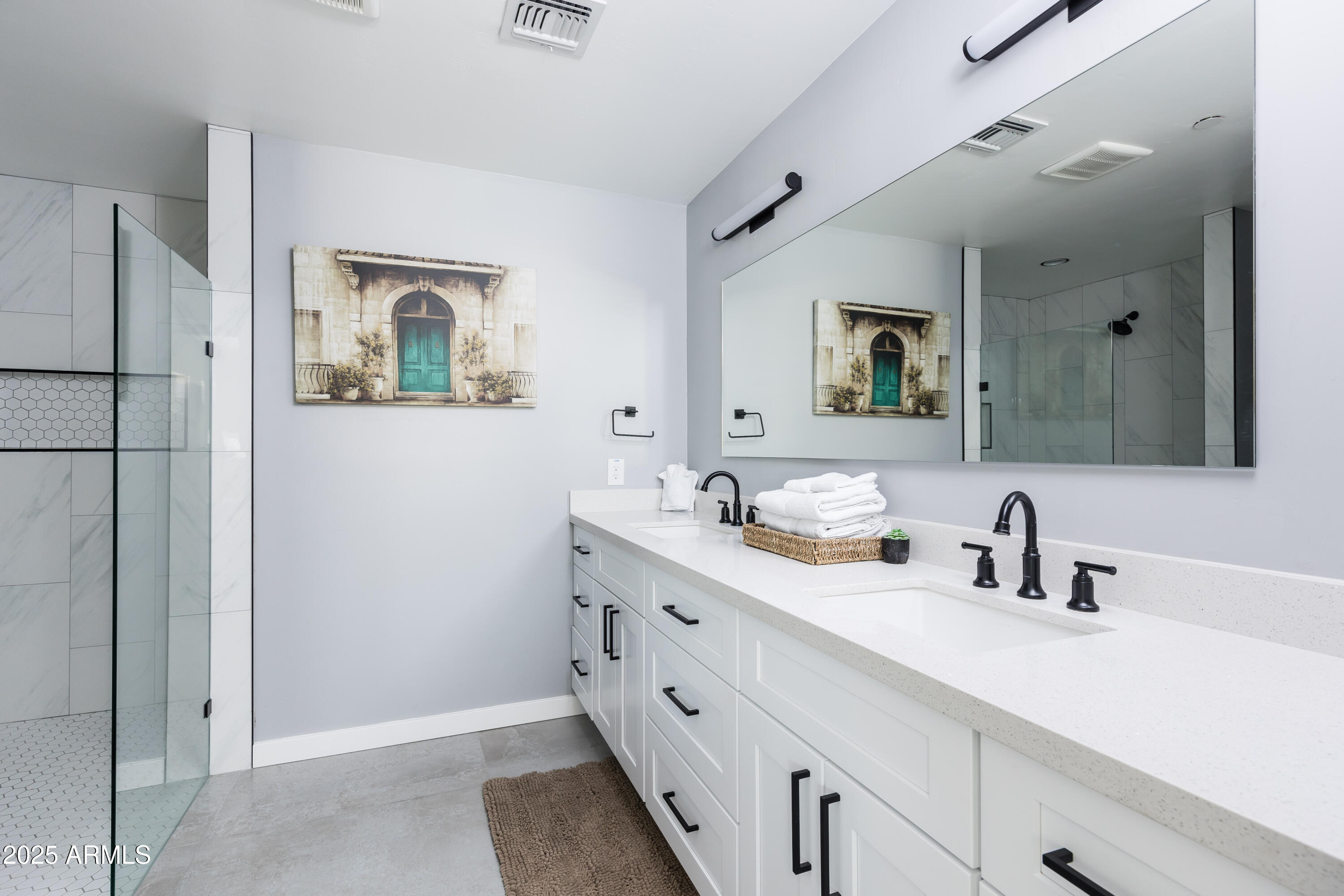 3043 North 85th Place Scottsdale, AZ 85251 - Photo 16 of 33 a bathroom with a double vanity sink mirror and bathtub