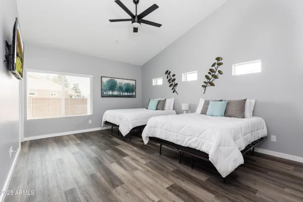 a living room with a bed furniture and a window