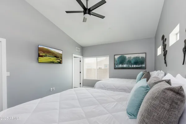 a bedroom with a bed and a window