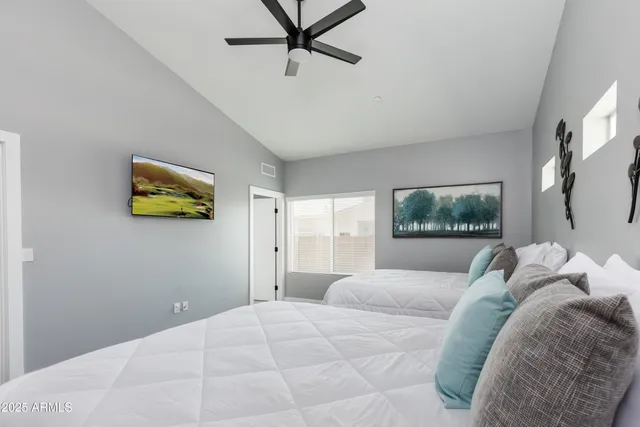 a bedroom with a bed and a window