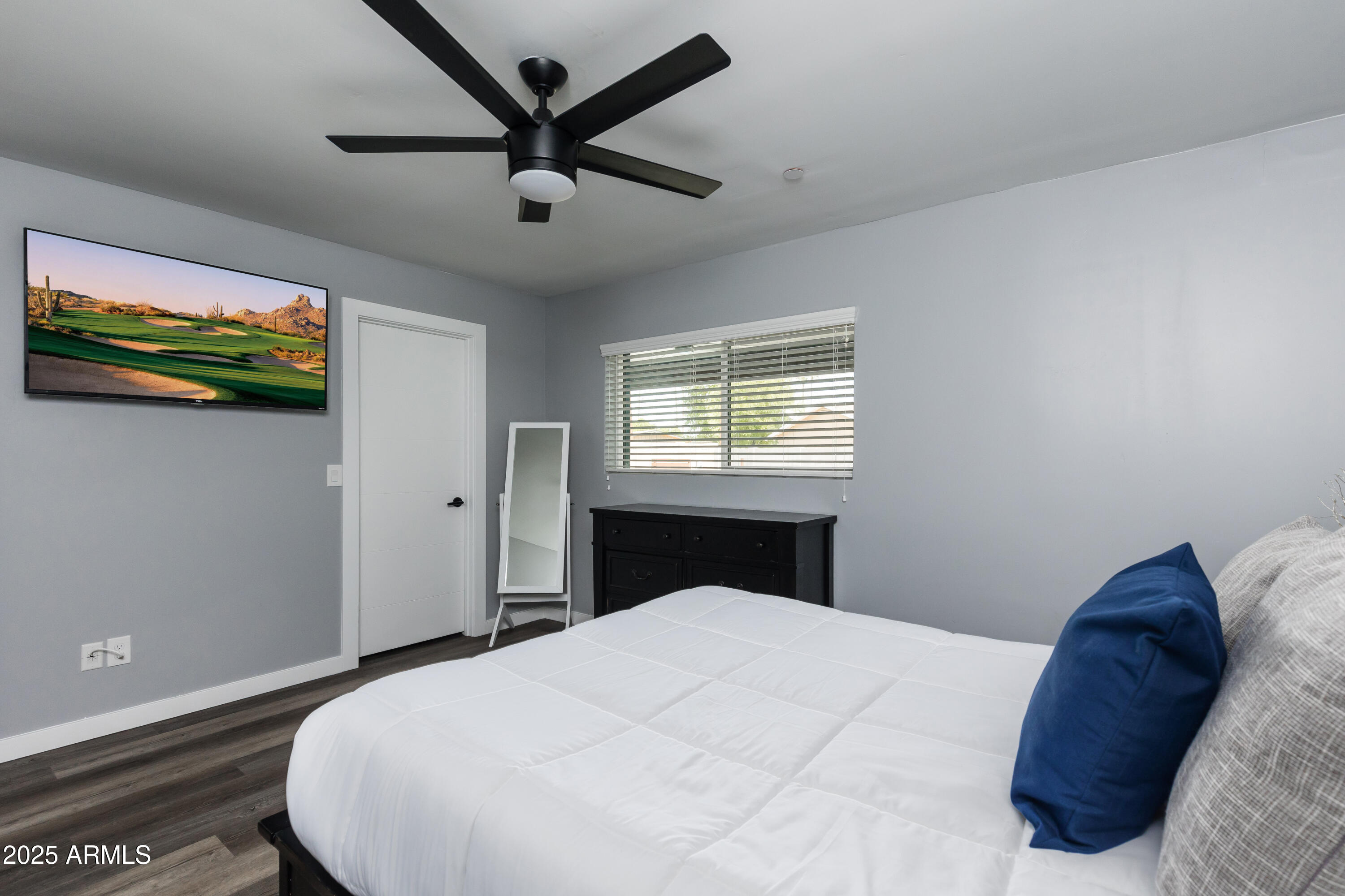 3043 North 85th Place Scottsdale, AZ 85251 - Photo 24 of 33 a bedroom with a bed and a window
