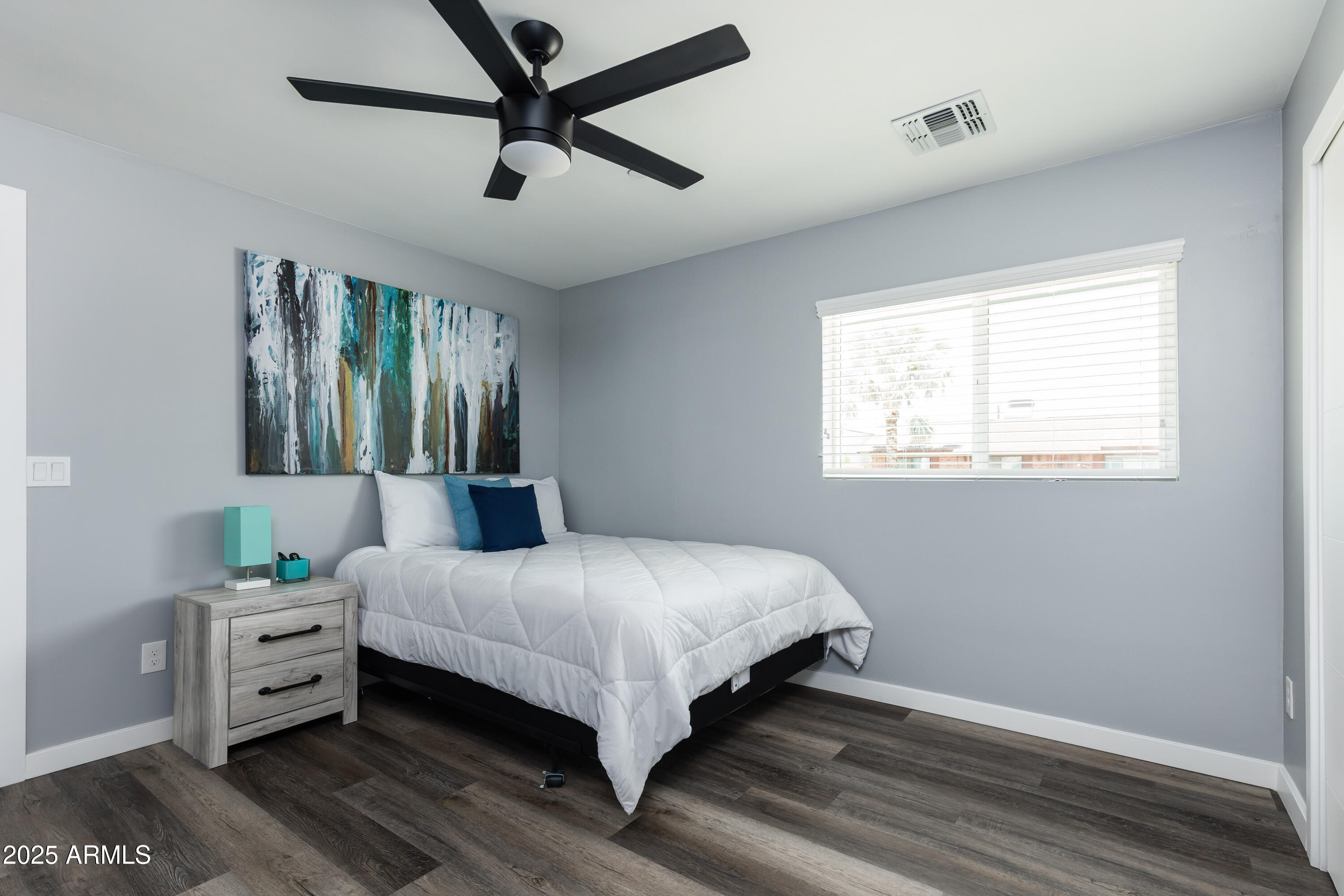 3043 North 85th Place Scottsdale, AZ 85251 - Photo 25 of 33 a bedroom with a bed and a window