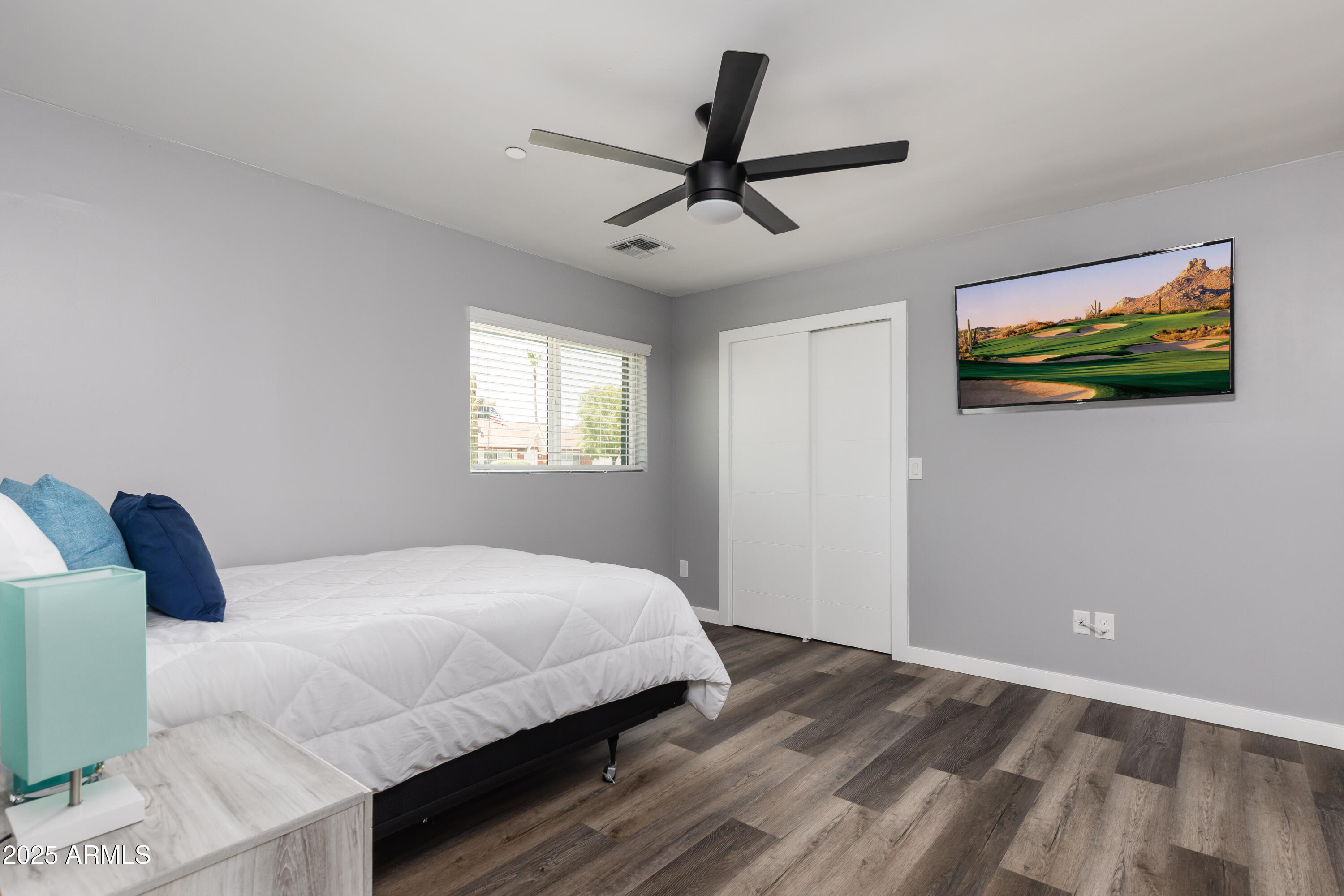 3043 North 85th Place Scottsdale, AZ 85251 - Photo 26 of 33 a bedroom with a bed and a window