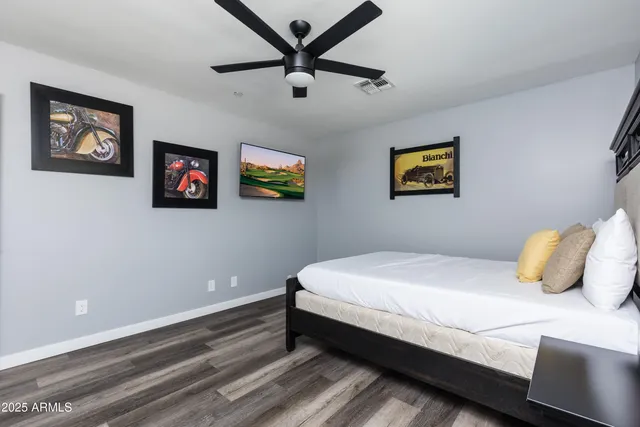 a view of a backyard with swimming pool and furniture