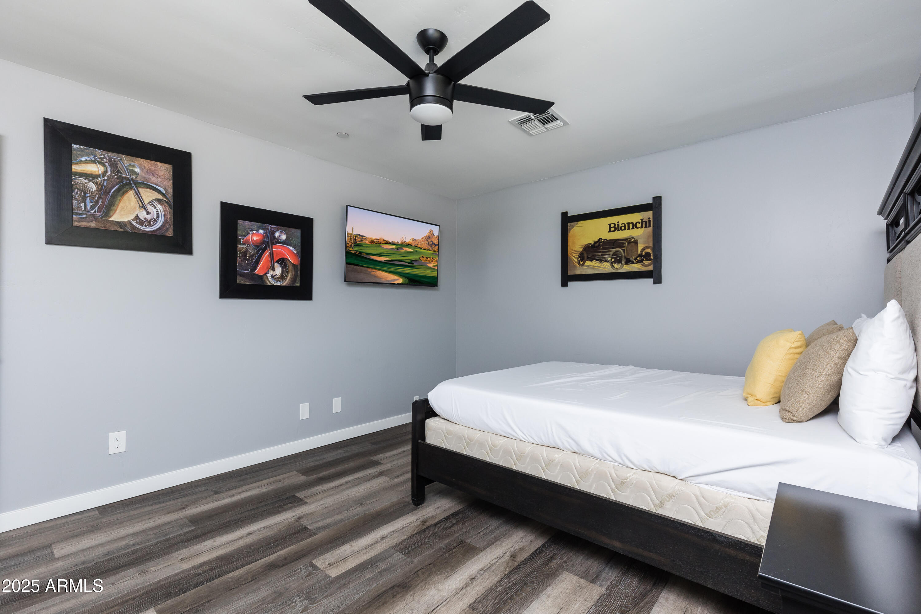 3043 North 85th Place Scottsdale, AZ 85251 - Photo 29 of 33 a bedroom with a bed and painting on the wall