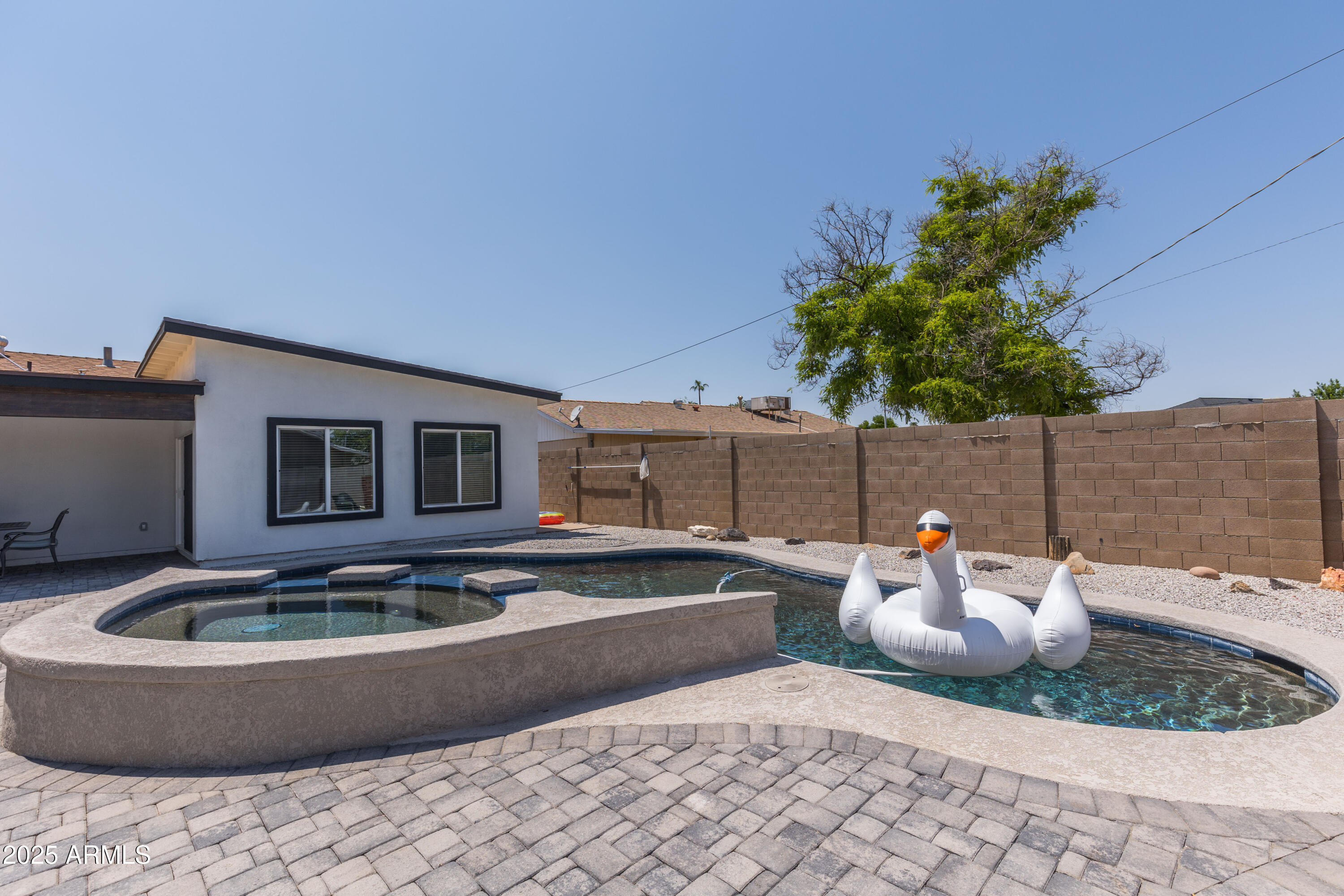 3043 North 85th Place Scottsdale, AZ 85251 - Photo 31 of 33 a view of a backyard with swimming pool and furniture