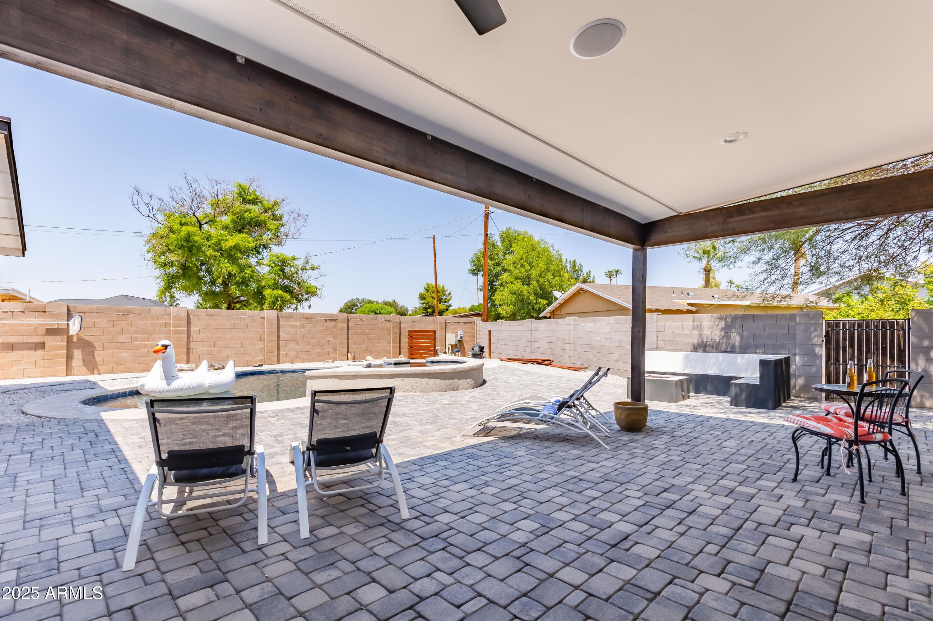 3043 North 85th Place Scottsdale, AZ 85251 - Photo 32 of 33 a outdoor space with lots of tables a chair and potted plants