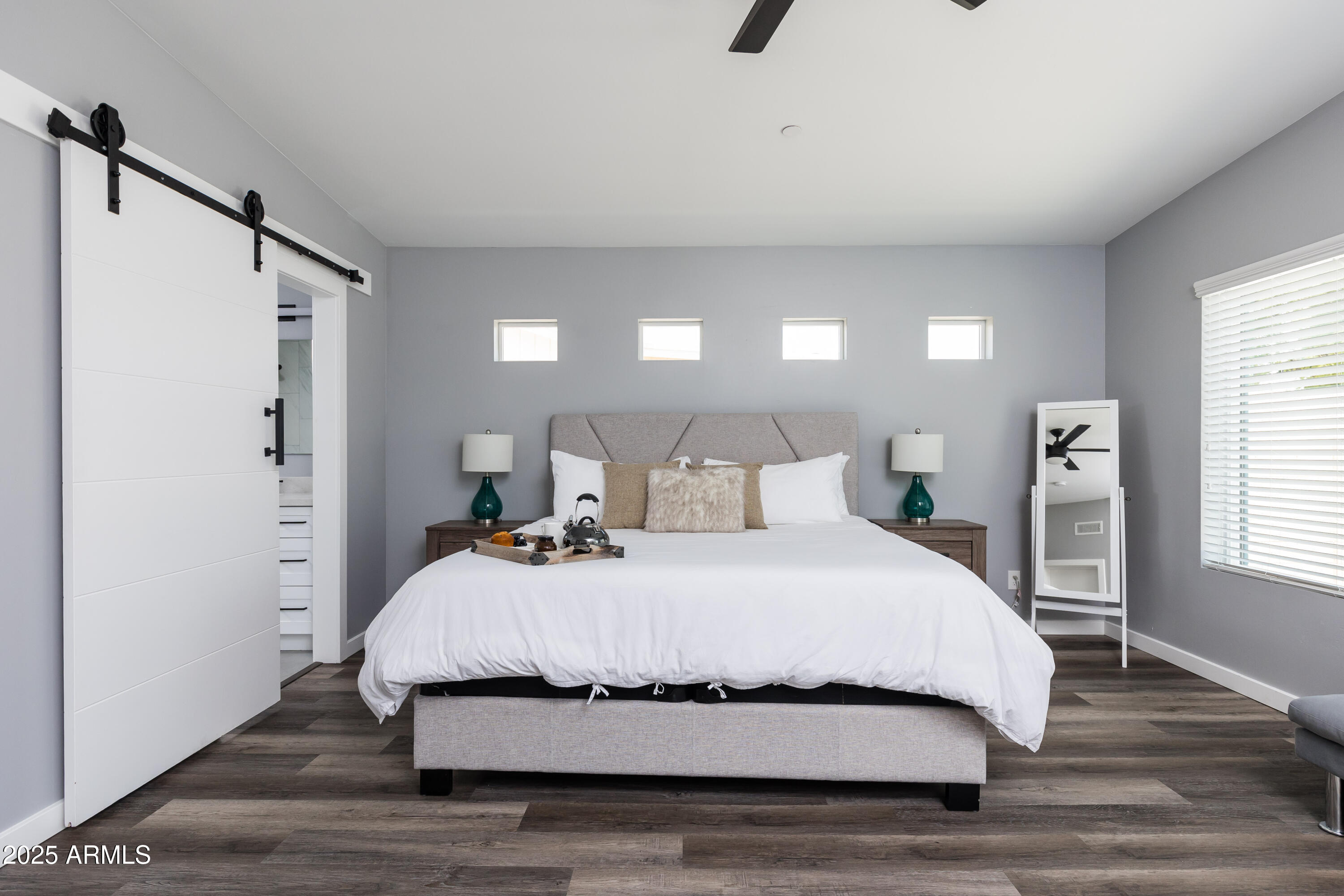 3043 North 85th Place Scottsdale, AZ 85251 - Photo 4 of 33 a bedroom with a bed and a night stand