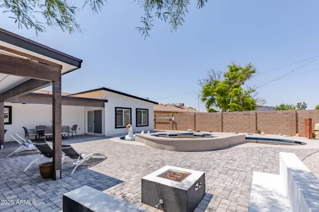 a kitchen with a sink stove and white cabinets
