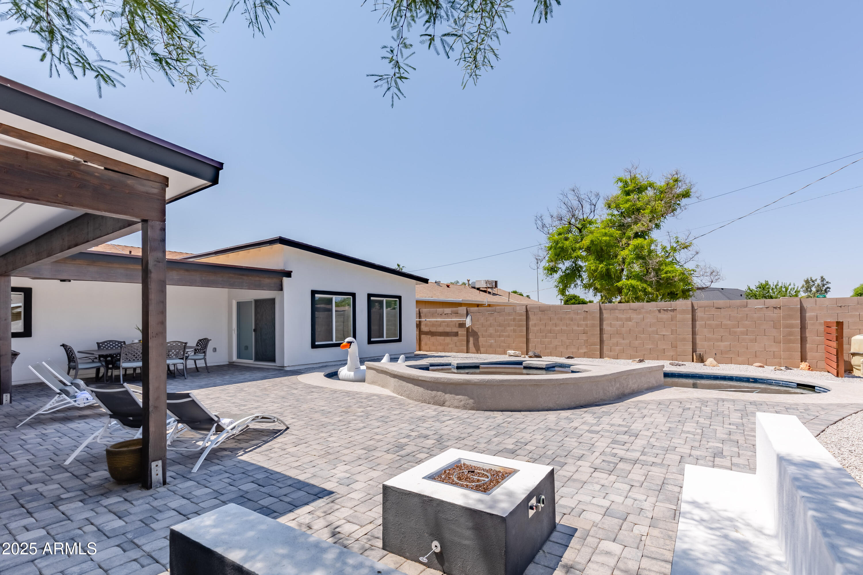 3043 North 85th Place Scottsdale, AZ 85251 - Photo 7 of 33 a house with lots of trees in the background