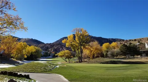 a view of a golf course with a lake