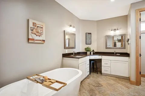 a spacious bathroom with a sink toilet and a mirror