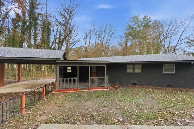 2332 Barge Road Southwest Atlanta, GA 30331 - Photo 24 of 30 a front view of a house with a yard