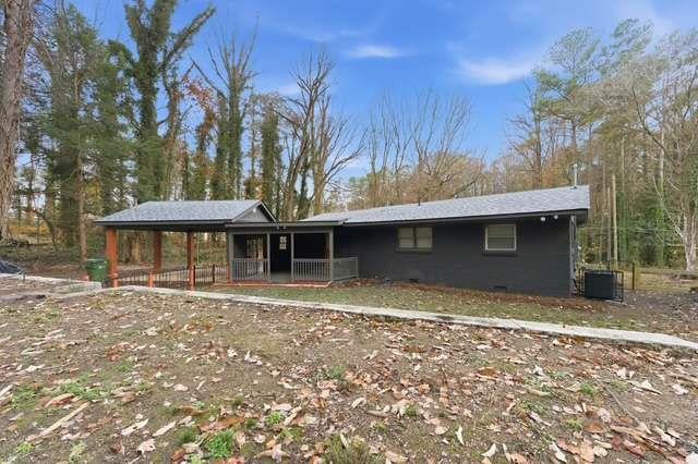 2332 Barge Road Southwest Atlanta, GA 30331 - Photo 25 of 30 a front view of a house with a yard