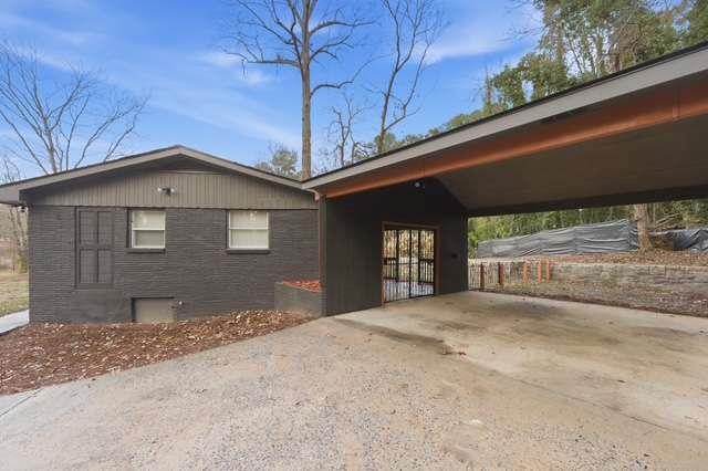 2332 Barge Road Southwest Atlanta, GA 30331 - Photo 29 of 30 a front view of a house with a outdoor space