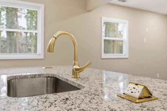 2332 Barge Road Southwest Atlanta, GA 30331 - Photo 5 of 30 a view of a kitchen with granite countertop a sink and a window