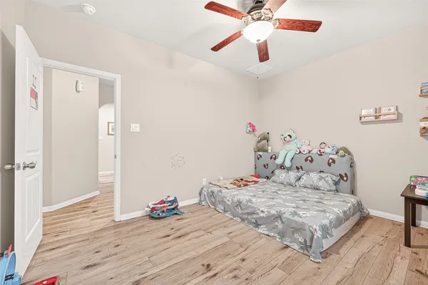 a bedroom with a bed and a dresser