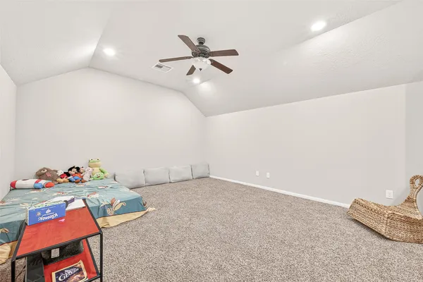 a view of a workspace with furniture and a large window