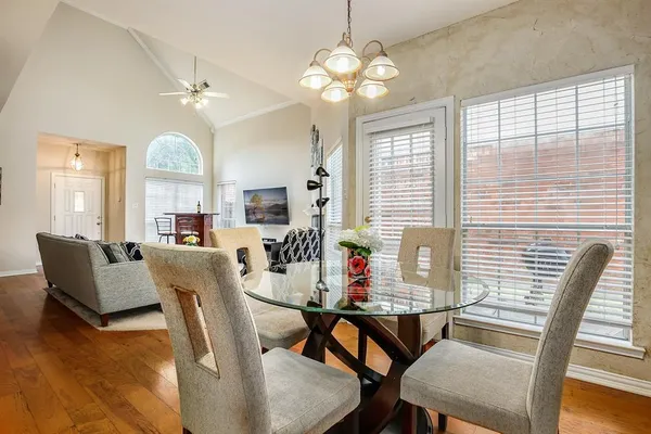 a dining room with furniture and window