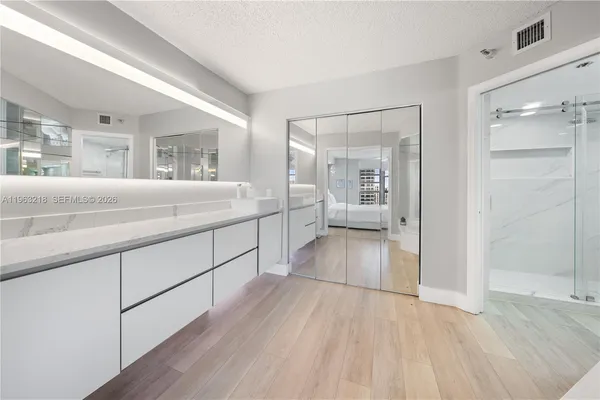 a bathroom with a sink and a mirror