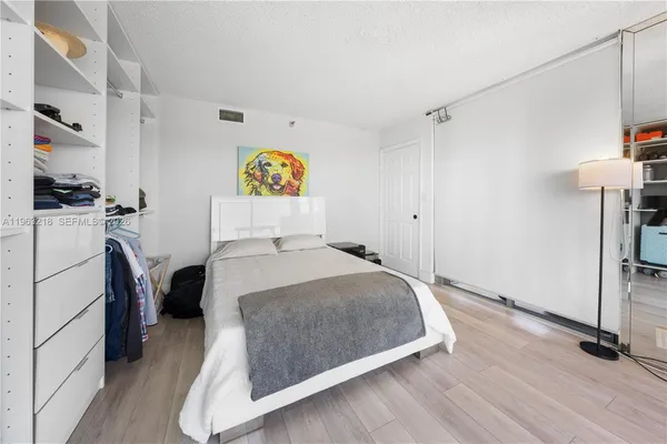 a bedroom with a bed and furniture