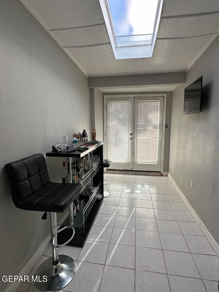 824 Destello Road El Paso, TX 79907 - Photo 6 of 16 a kitchen with a table chairs and a stove