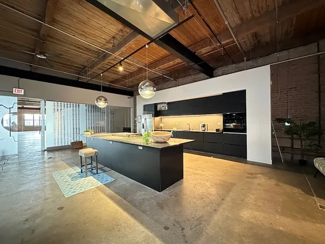 a view of a swimming pool with a chairs