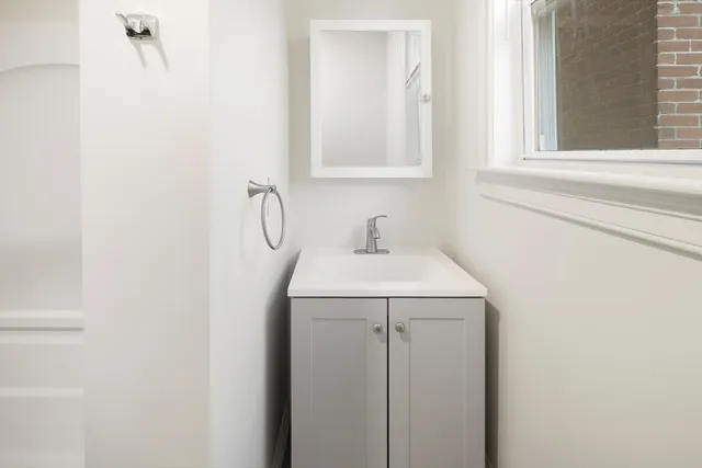 a bathroom with a sink and a vanity