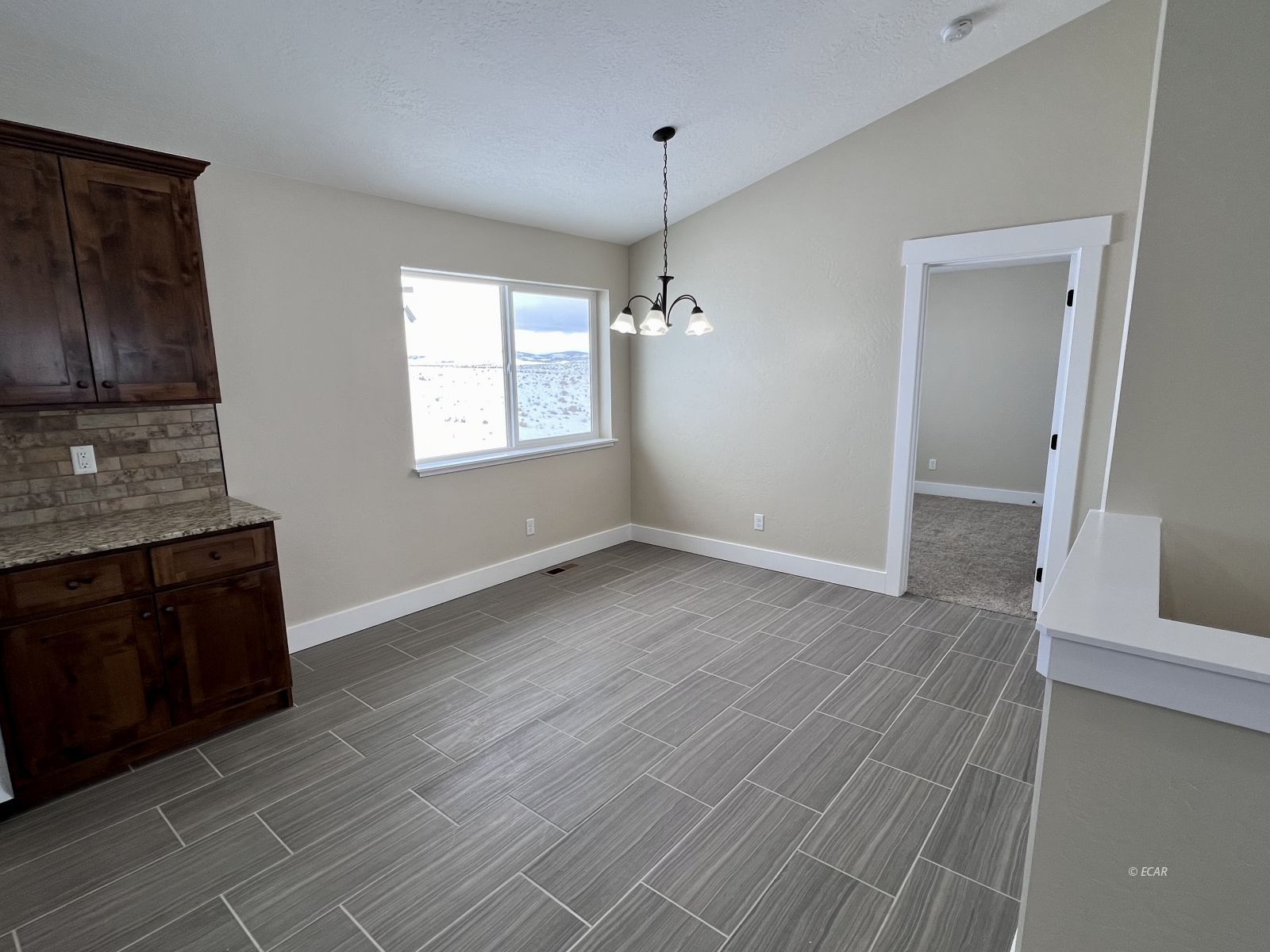997 Sun Vly Road Spring Creek, NV 89815 - Photo 8 of 27 a view of a kitchen from the hallway
