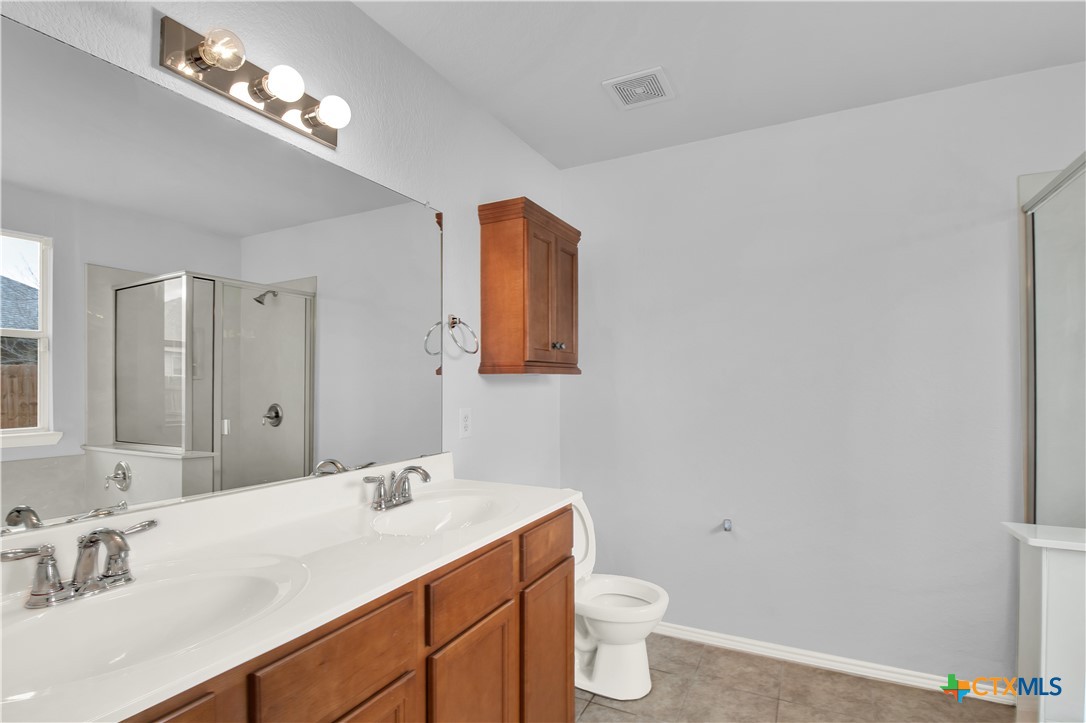 117 Bashaw Loop Temple, TX 76502 - Photo 14 of 20 a bathroom with a sink vanity granite and a toilet