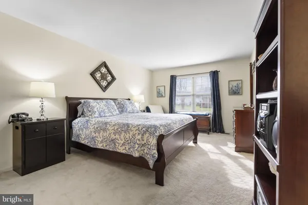 a bedroom with a bed and a closet