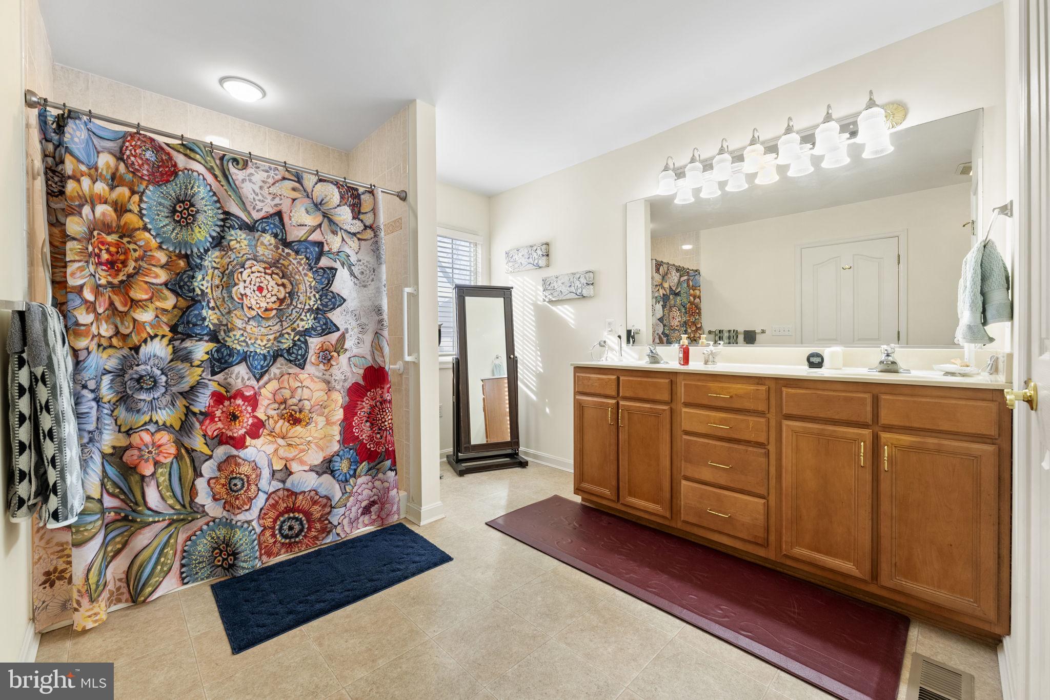 212 Spring Crest Drive Salisbury, MD 21804 - Photo 29 of 42 a spacious bathroom with a double vanity sink mirror and shower