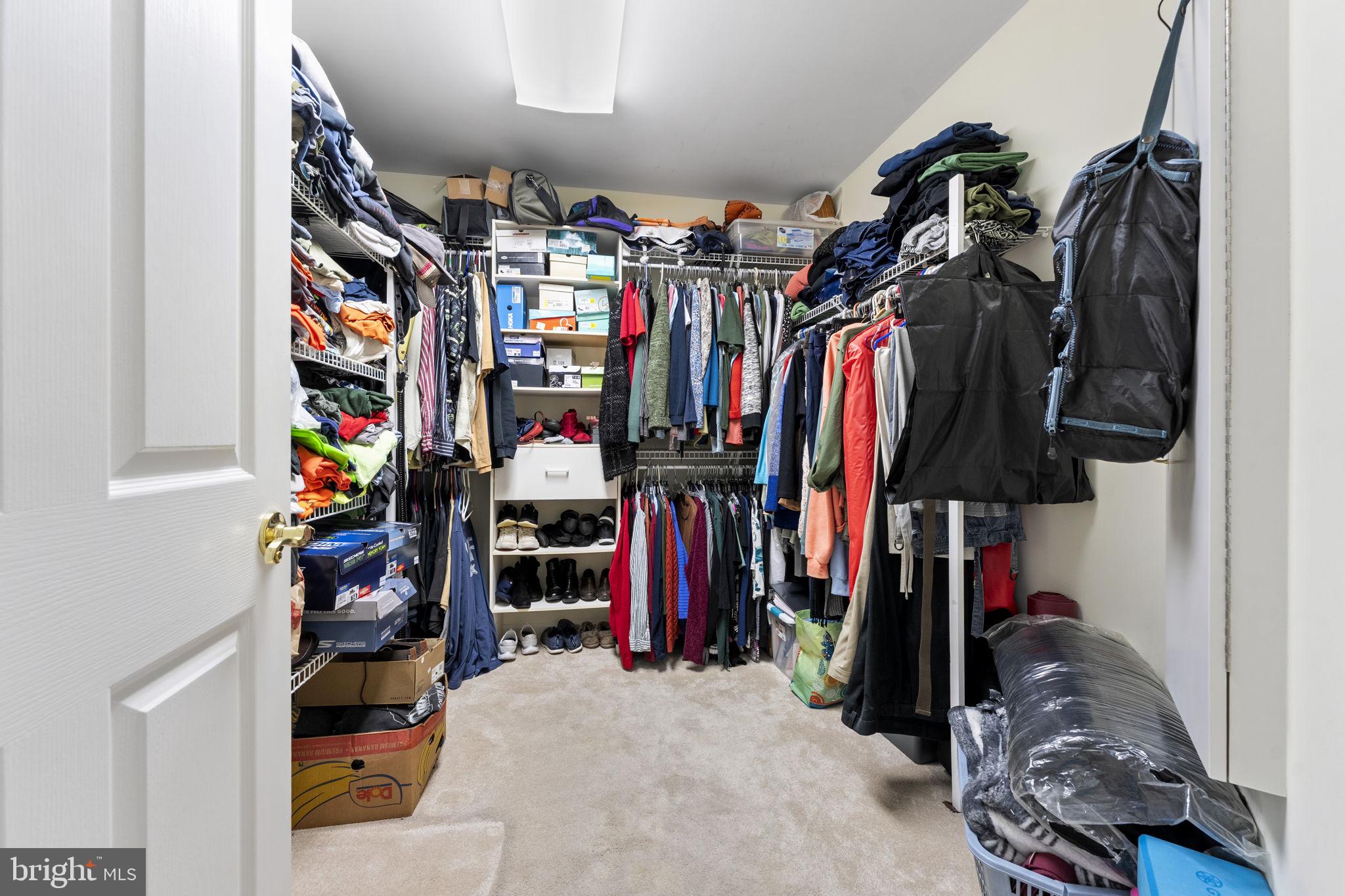 212 Spring Crest Drive Salisbury, MD 21804 - Photo 30 of 42 a view of walk in closet with clothes and shoes